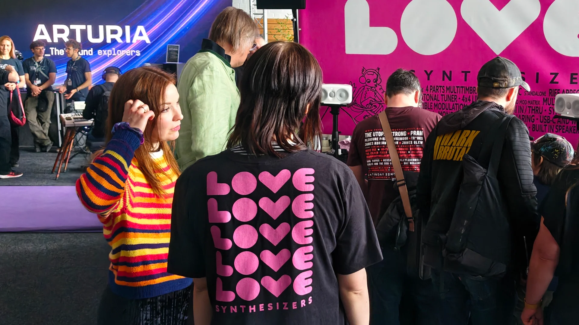 LOVE identity across the FIRST LOVE trade-show display.