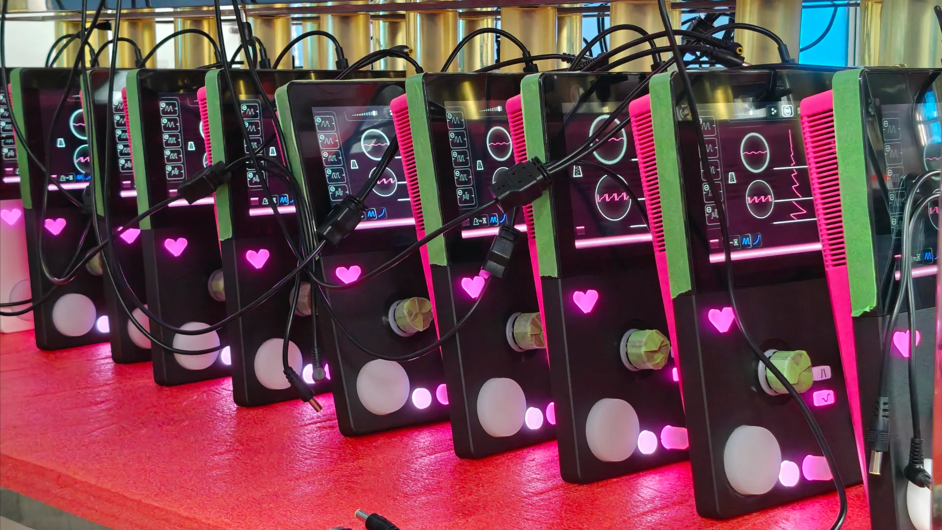 A row of FIRST LOVE instruments undergoing production testing.